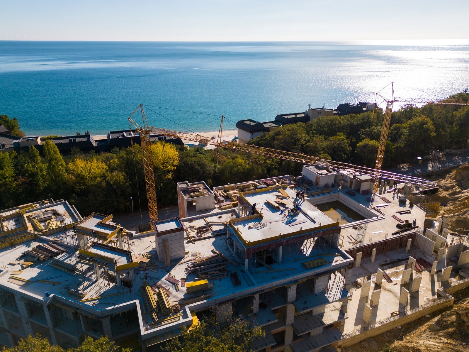 Aerial view of the construction of a massive beachfront hotel